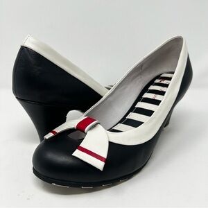 Chic Black and White Heels with Red Bow